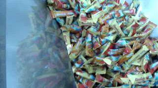 Vibratory feeder and bucket elevator for candy
