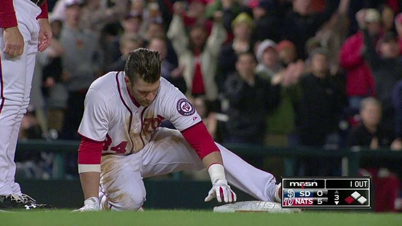 Bryce Harper hurts knee running out grounder in slip atop first base