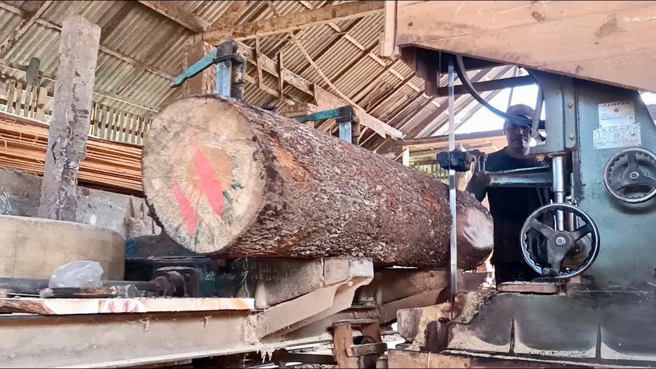 The process of sawing pine wood into thin planks - YouTube