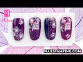 Nail art with ladybug and flower for spring (nailstamping.com)