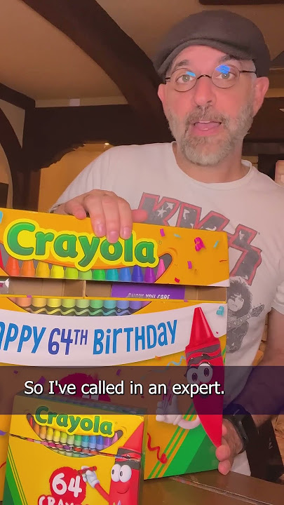 Opening a gift from Crayola