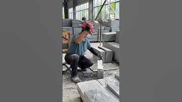 Using a chisel tool to break the hard concrete into pieces for easy stacking #construction #tools