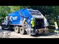 Kansas City Rear Loader Garbage Truck on Amnesty Day Bag Piles