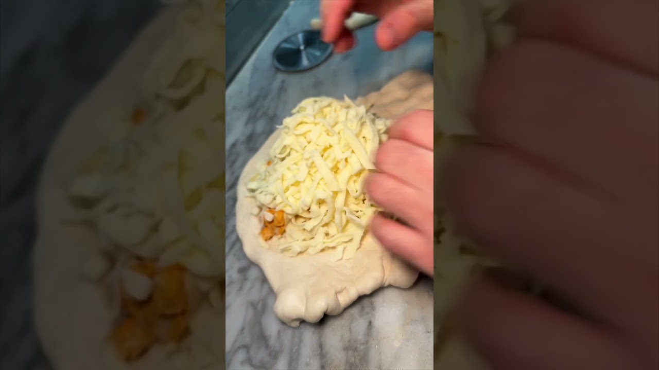 CHEESY BUFFALO CHICKEN CALZONE from Nuovo York Pizza in NYC’s East Village!!! 🧀🍗🔥🍕🤤#DEVOURPOWER