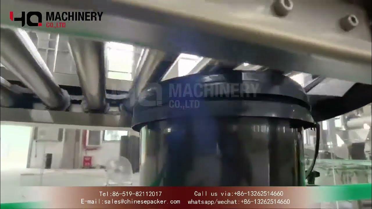 Automatic pail lid placer and closer with cap feeding systemYQ