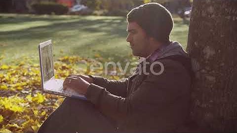 College student on campus using laptop computer | Stock Footage - Envato elements