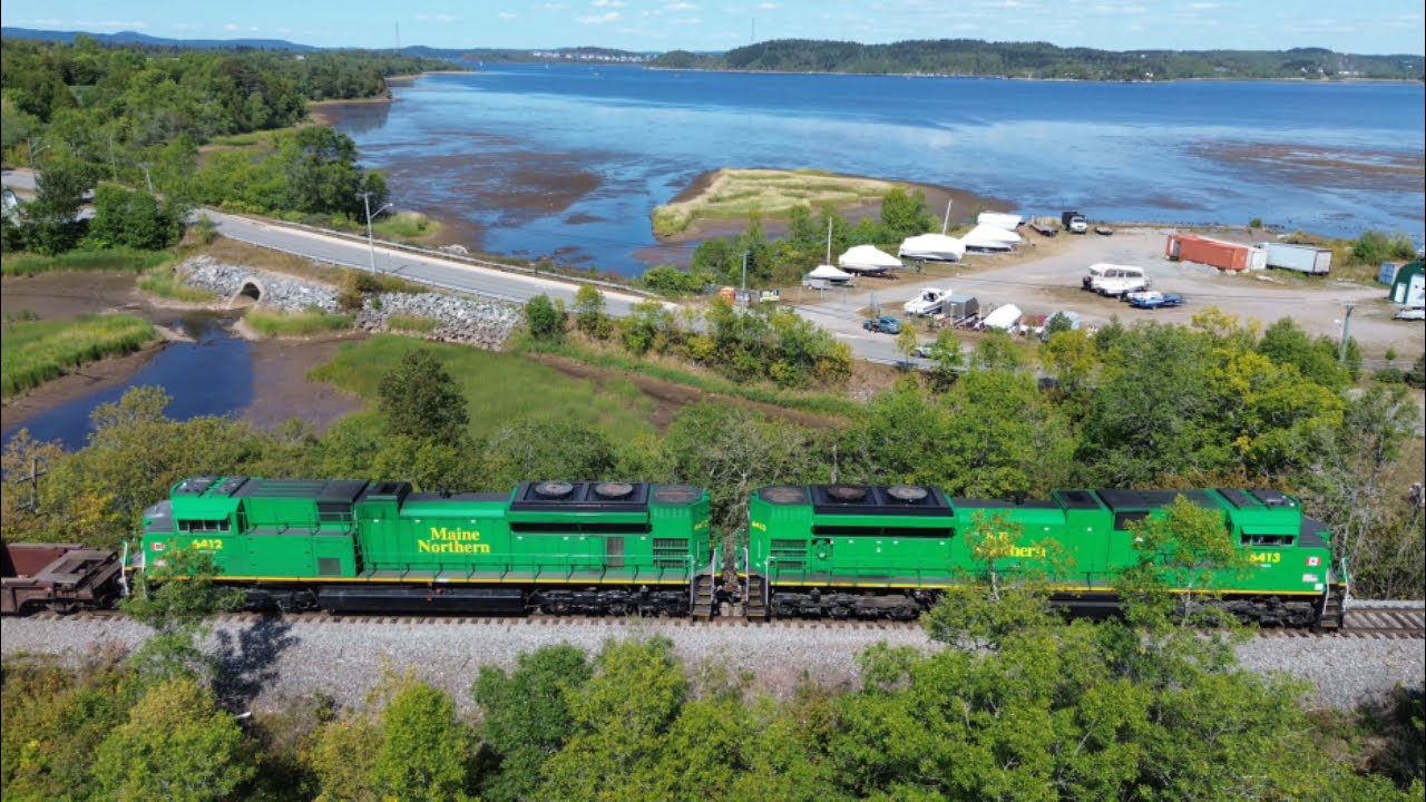 Awesome Aerial 4K View! Extra Stack Train NBSR Work 6413 passing South Bay Approaching Saint John NB