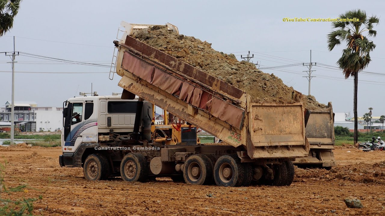 Dump Trucks Dumping a Load of Dirt with Bulldozer Pushing Dirt YouTube