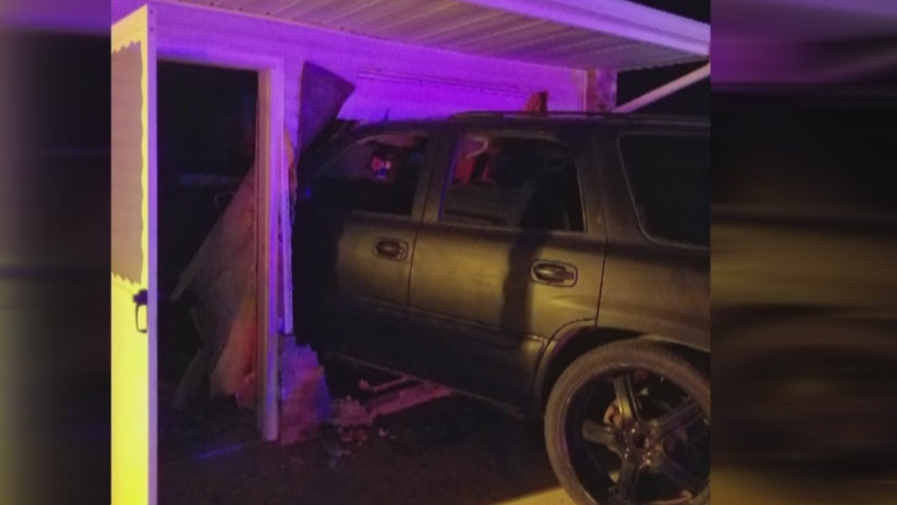 Police: Fleeing suspect abandoned SUV before it crashed into home