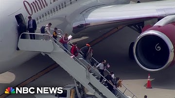 White South Africans arrive in U.S. from Johannesburg