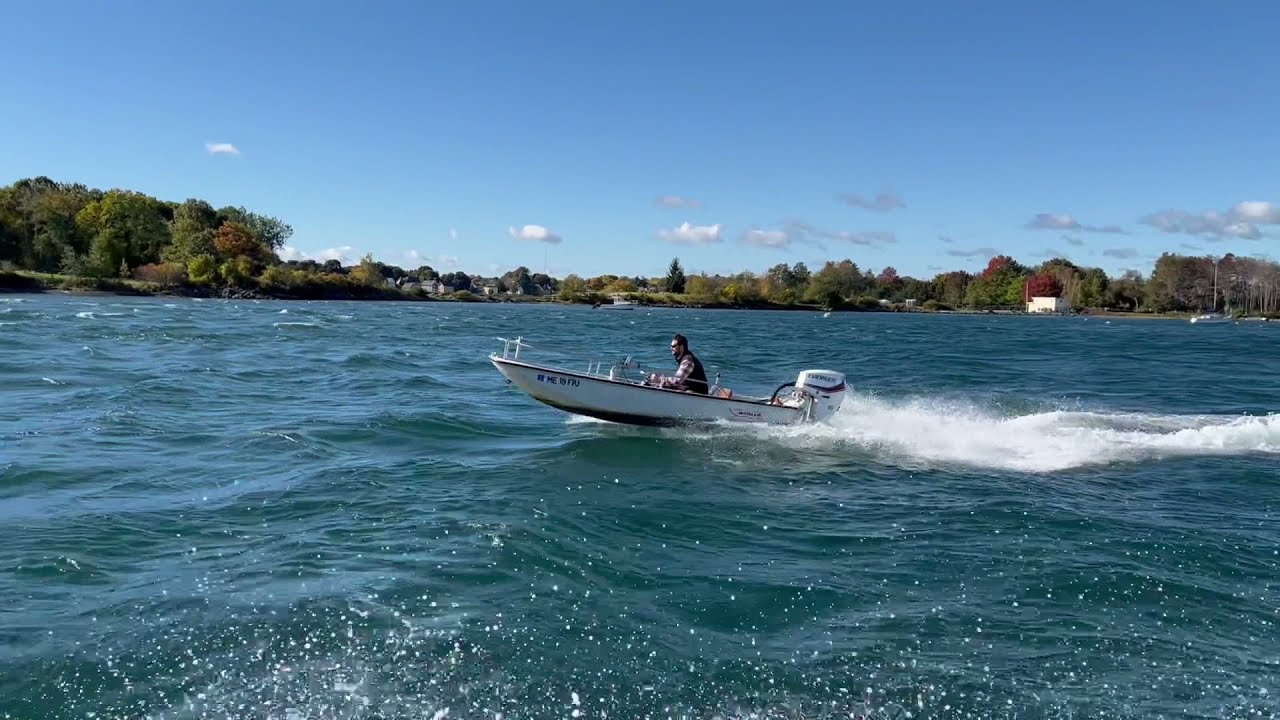 13 Boston Whaler in a rough chop. 40hp etec.