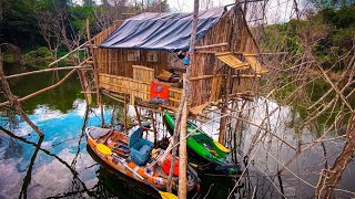 Rowing a small boat, fishing at a house in the middle of the water, and cooking.