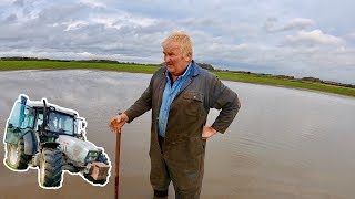 FARMER IS FURIOUS ABOUT FLOODS... KNOCKING POSTS IN MIGHT HELP!