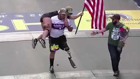 Vet with prosthetic leg carries guide across Boston Marathon finish line