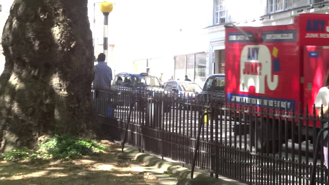 Ferrari FF driving around Berkeley Square London