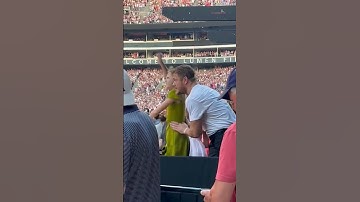 Thumbnail of Dan Reynolds and his daughter Arrow at Taylor Swift concert