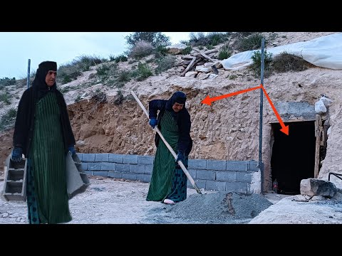 Concrete and blocks: Grandmas tools to build a security and beauty fence in front of the cave