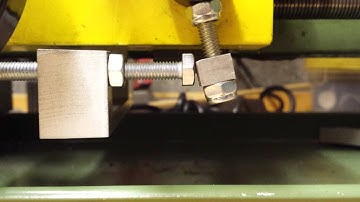 Auto feed stop for a mini lathe