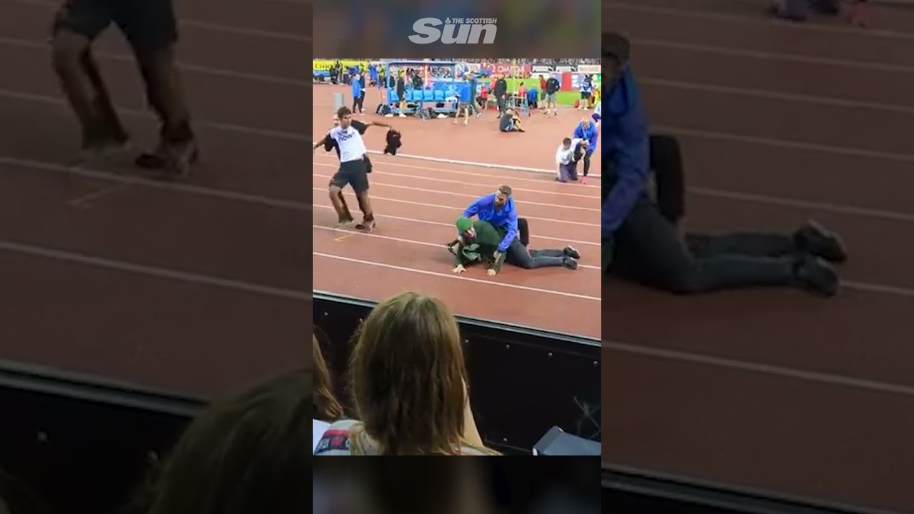 Eco protesters wrestled to ground at athletics meet