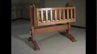 A cradle I built for my Granddaughter from timbers salvaged from her Great Grandfather