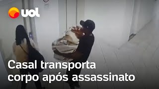 Câmaras mostram casal levando corpo em mala após assassinato; vídeo screenshot 2