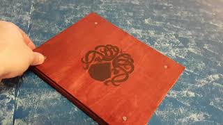 I decided to try to make my own game master screen. Bought some woodburning panels and woodburned some details, ...