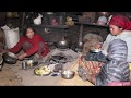 Cooking food traditional way and feeding to their children