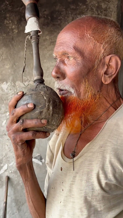 Old man having Hookah in village | 2023