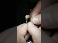 Old mine cut moissanite engagement ring with natural diamond accents in 14k gold