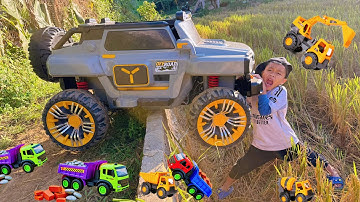 Em tu bi tổng hợp cần cẩu móc xi măng làm nhà cao tầng, máy xúc múc cát cùng xe ben điều khiển