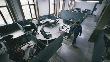 Security camera view of people working at office