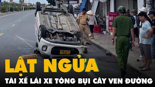 Tài xế taxi tông trúng bụi cây ven đường khiến xe lật ngửa screenshot 2