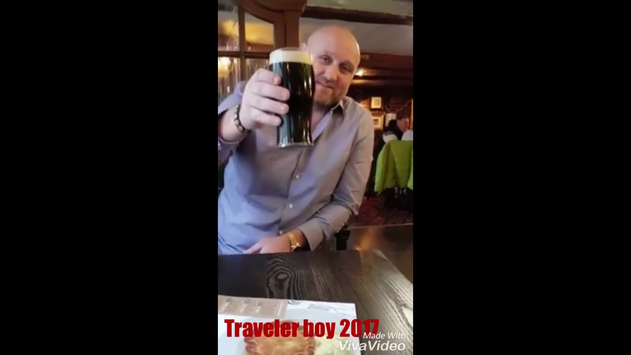 Traveler Man Drinking A Pint Of Guinness