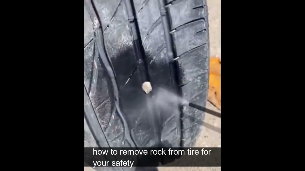 remove rock from tire for safety - YouTube