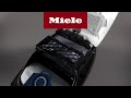 How can I replace the spacer bracket Air-Clean filter on my Classic C1? | Miele