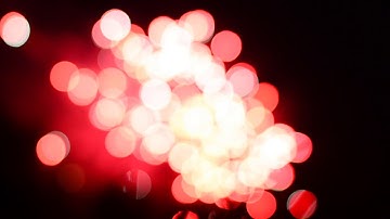 Abstract bokeh background - defocused fireworks display. SEAMLESS LOOP.