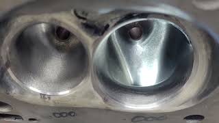 Chevy Bowtie cylinder heads 034, third cut and plain exhaust valve flows. Can plain be better?