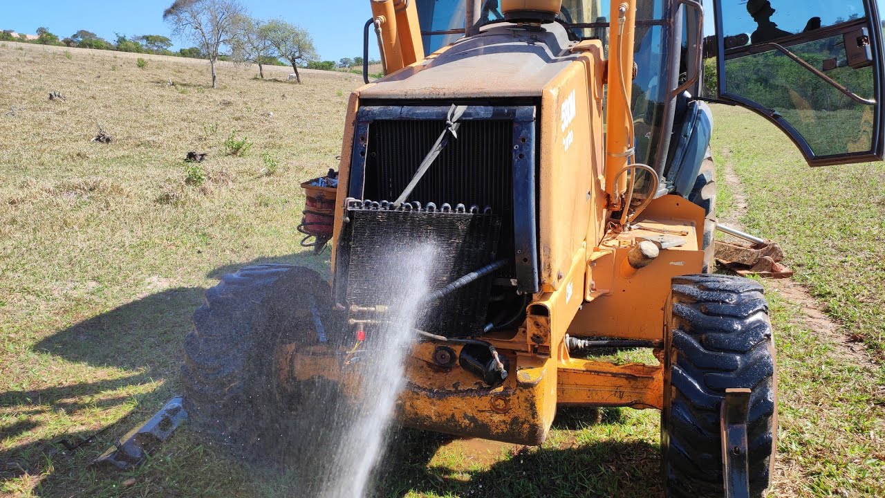 Desmontando e lavando radiadores retroescavadeira case