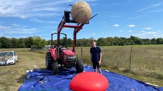 Giant 800 Pound Rubber Band Ball Vs Giant Water Balloon