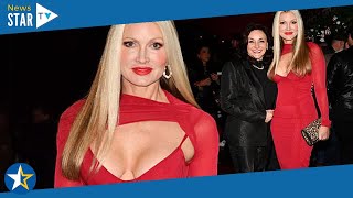 Caprice Bourret, 50, wows in a plunging red dress and towering stilettos 240629