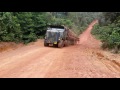 Wrongly loaded Oshkosh logtruck can`t climb a steep mountain