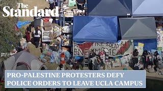 Protesters defy police orders to leave Los Angeles university campus after clashes with rival groups