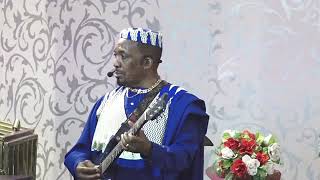 How Apostle Nganga plays his guitar in his church