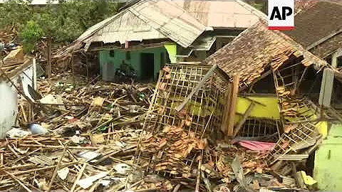 Extent of tsunami destruction readily visible in S...