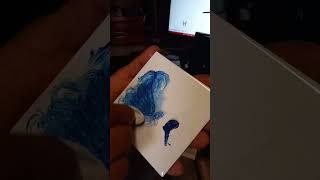 Backfilling a laser engraved tile with acrylic paint.