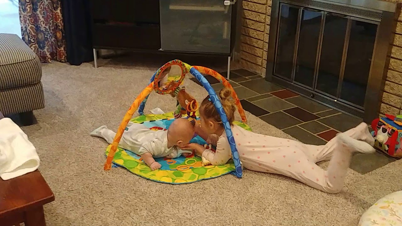 Tummy time with sister - YouTube