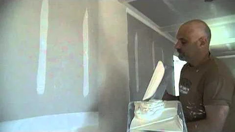 How to first coat a drywall butt joint with a hawk and trowel