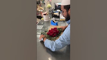 Thumbnail of Red roses wrapped in a natural burlap and tied with a red ribbon🌹#@Flowershop007