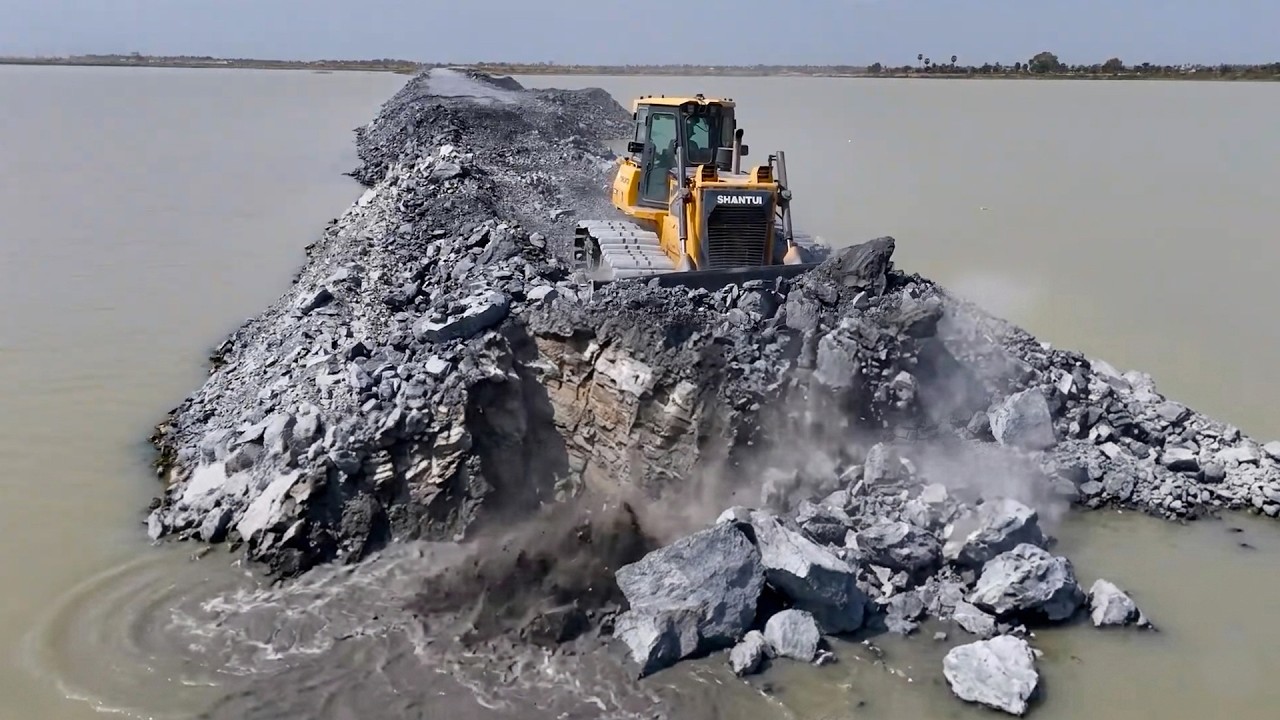 Amazing bulldozer operation, including work along land boundary and collaborative task handling