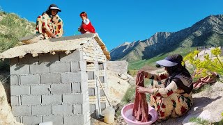 Life in the mountain: cementing the ceiling of the bathroom and toilet by Zari, a nomadic lady